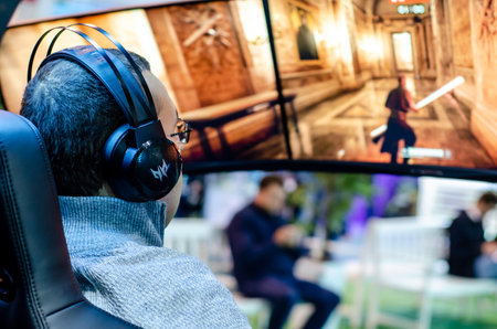 Kyiv, Ukraine - April 12, 2019: Man are playing a video game in the Acer Predator Thronos