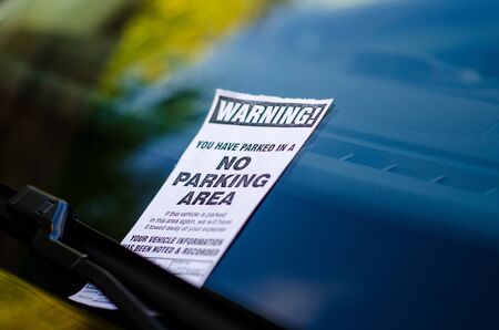 Close-up of parking ticket on car's windshieldの写真素材