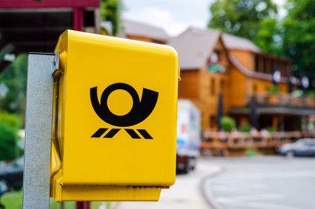 Delecke, Germany - August 1, 2019: Deutsche Post Mailbox. The Deutsche Post AG, operating under the trade name Deutsche Post DHL Group, is a German postal service and international courier service.のeditorial素材
