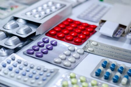 Close-up of different pills in a blister pack.