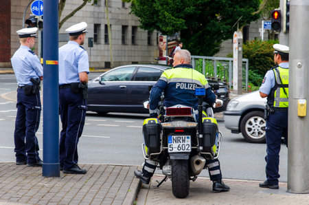 Dortmund, Germany - August 2, 2019: Police officers patrolled and keeps order at the public event.のeditorial素材