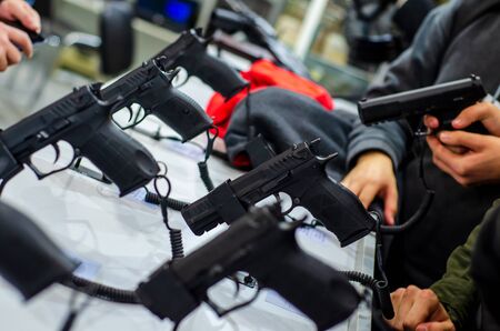 Gun Display Stands. Pistols for sale in the store.