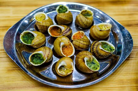Helix Aspersa Muller, Maxima snail.  Edible snails with butter and seasonings.の写真素材