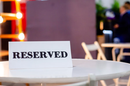 Reserved Sign On A Table In Restaurantの写真素材