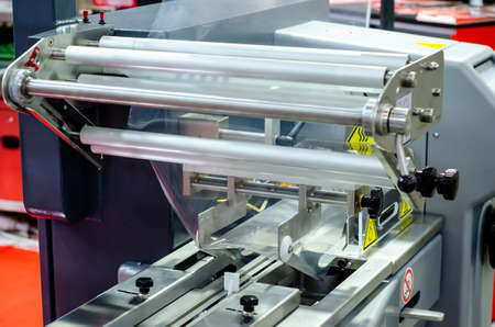 Automatic packaging machine for producing packs from a roll of heat-sealable packaging filmの写真素材