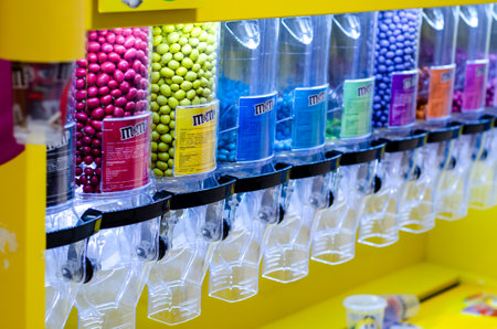 Soest, Germany - August 7, 2021: M & M'S Candies at Candy Dispenser Machines in the supermarketのeditorial素材