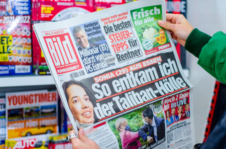 Soest, Germany - August 20, 2021: Hands holding Bild newspaperのeditorial素材