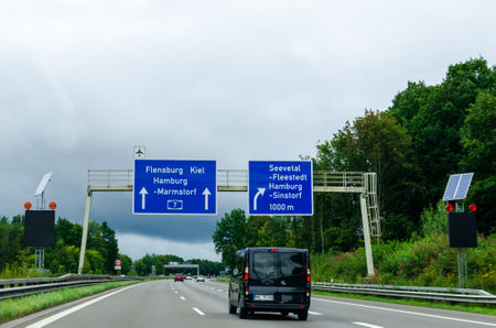 Seevetal, Germany - August 28, 2021: Road traffic on the German Highway (autobahn) A7 with road signs.のeditorial素材