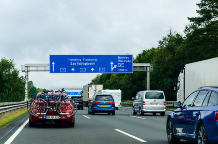 Lower Saxony, Germany - August 28, 2021: Road traffic on the German Highway (autobahn) A7 with road signs.のeditorial素材