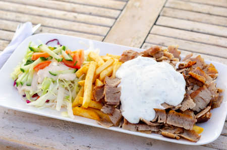 Doner meat with french fries and saladの写真素材