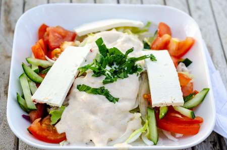 Fresh vegetable salad with feta cheeseの写真素材