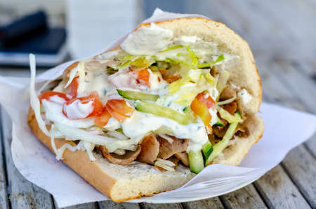 Doner kebab as a sandwich. Doner kebab is a type of kebab, made of meat cooked on a vertical rotisserie.の写真素材