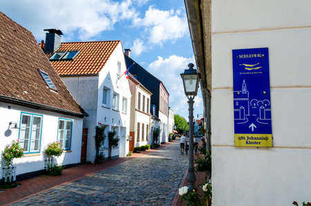 Schleswig, Germany - September 01, 2021: Entrance to the historic houses in Holm fishing villageのeditorial素材