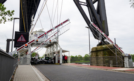 Rendsburg, Germany - May 11, 2022: Rendsburg Transporter Bridge (Schwebefaehre). The hanging ferry under the bridge span.のeditorial素材