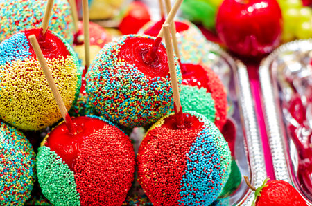 Apples covered with glaze in for sale at the fair.の写真素材