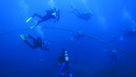 Silhouette scuba diving.