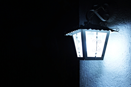 Candelabrum type lamp lit at nightの写真素材