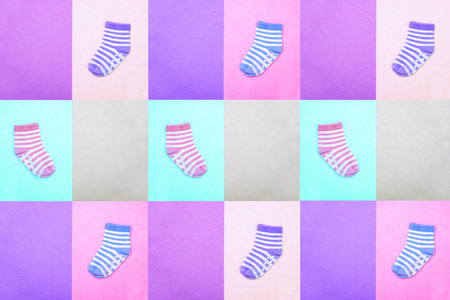 Socks for children. View from above. Multi-colored striped socks on pastel backgrounds. Abstract seamless texture in the style of pop art.の写真素材