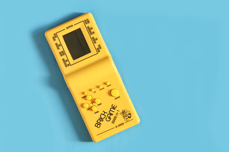 07.20.2018, Rostov-on-Don. Electronic tetris game isolated on blue backgroundの写真素材