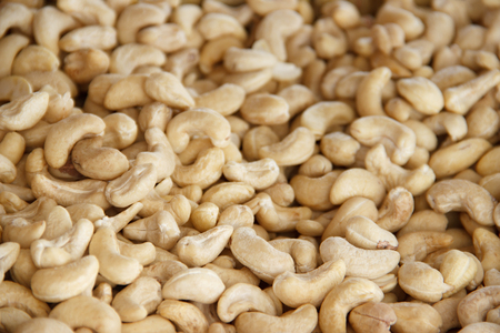 Cashews nut background. kernels of peeled nuts close upの写真素材