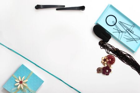 Accessories and hair pins flat lay. Sponge for hair, hairdo babette. necklaces of beads or flowers,...