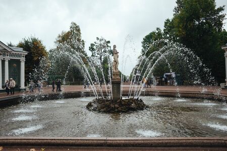 Saint Petersburg, Russia - 18 September 2015 - Fountaine in the upper garden in Peterhof park in rainy day.のeditorial素材