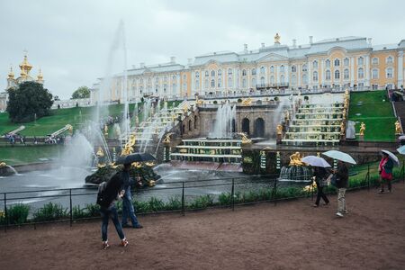 Saint Petersburg, Russia - 18 September 2015 - Neptune fountaine in the upper garden in Peterhof park in rainy day.のeditorial素材