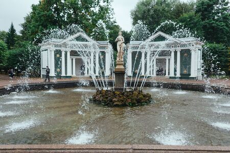 Saint Petersburg, Russia - 18 September 2015 - Fountaine in the upper garden in Peterhof park in rainy day.のeditorial素材