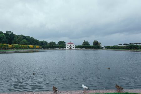 Saint Petersburg, Russia - 18 September 2015 - fountaine and pond with ducks in the upper garden in Peterhof.のeditorial素材