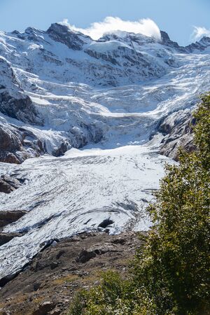 Dombay mountains, trekking in national park to the Alibek waterfall and glacier, beautiful autumn...