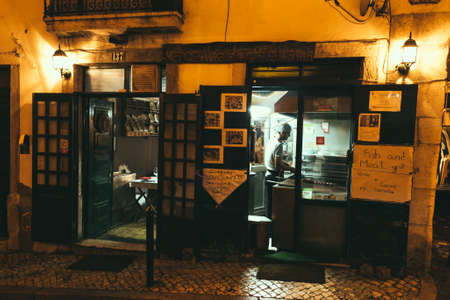 Lisbon, Portugal - 10 September 2014. Night in Lisbon, grill domestic restaurant in the center of old town in Alfama.のeditorial素材