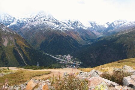 Dombay ski resort from the Mount Mussa Achitara, beautiful mountains landscape, small village and...