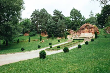 Green forest and red stones in Kislovodsk national park - the biggest park in Europe, summer season,...