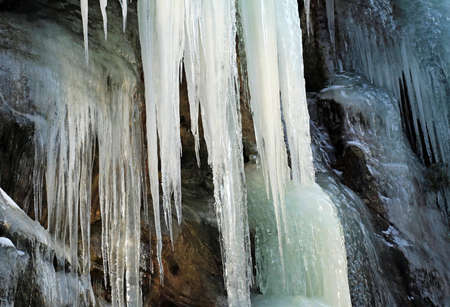 Icefalls on rocks with icicles in the Kozakov Forest in Czech Paradiseの写真素材
