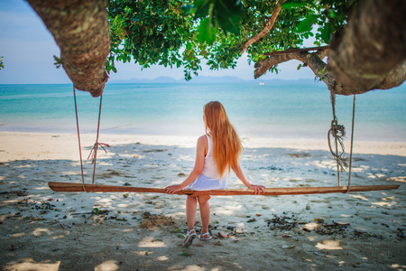 Happy young woman on the beachの写真素材