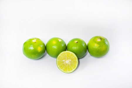 Green Lemons isolated on white background.の写真素材