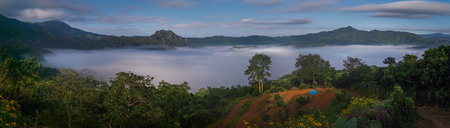 The Mist with Mountain Background in the night, Landscape at Phu Langka, Payao Province, Thailandの写真素材