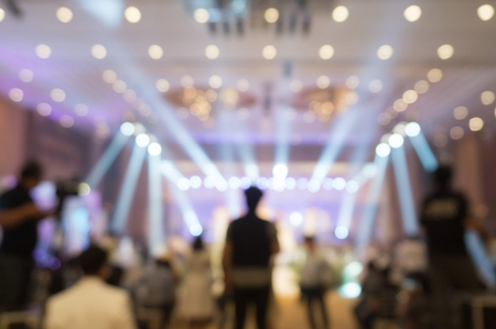 Cameraman recording video of  Wedding fair out of focus,blur background.の写真素材