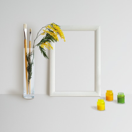 Mock up with Frame, Mimosa and brushes on white backgroundの写真素材