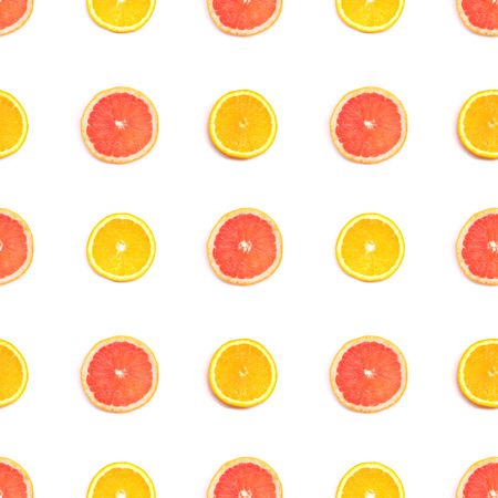 Seamless pattern of orange, grapefruit slices on white backgroundの写真素材