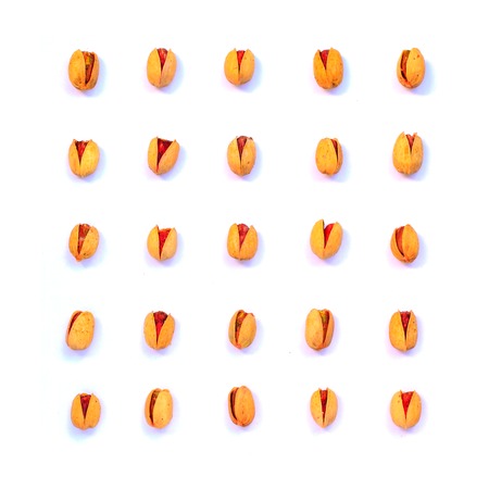 Pistachios organized on white background. Nuts flat layの写真素材