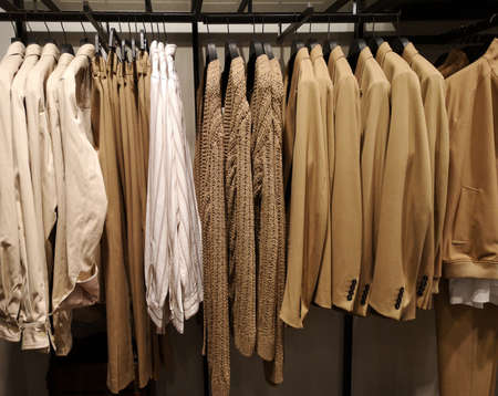 Row of clothes garment fashion beige collectionの写真素材