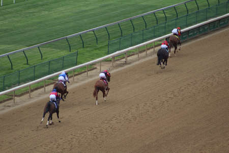 LOUISVILLE, KENTUCKY - APRIL 28, 2021: Horses approach finish line in a claiming race at Churchill Downs on Apr 28, 2021 in Louisville, KY. Winner is "Scabbard" (far right.)のeditorial素材