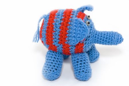 Knitted blue elephant with red stripesの写真素材