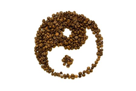 In and Yan made of coffee beans isolated on white backgroundの写真素材