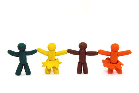 Four clay human figures isolated on white backgroundの写真素材