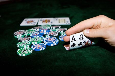 Poker table with chips and cards on itのeditorial素材