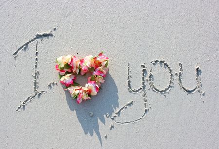 I love you sign on the sandy beachの写真素材