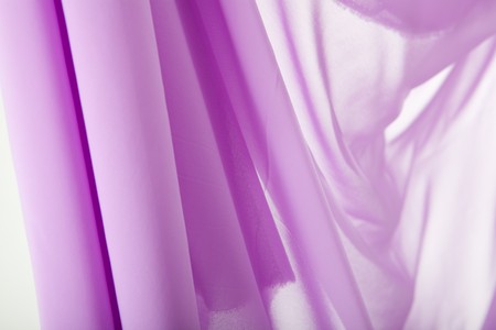 Purple transparent fabric in studio shot on white backgroundの写真素材