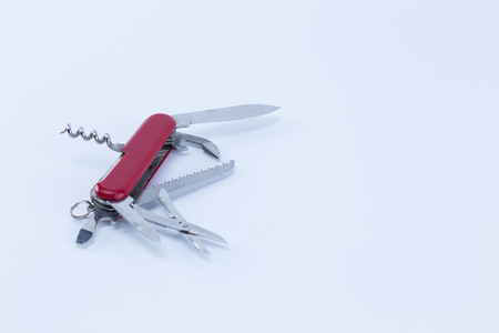 Multipurpose multi tool swiss knife isolated on white background